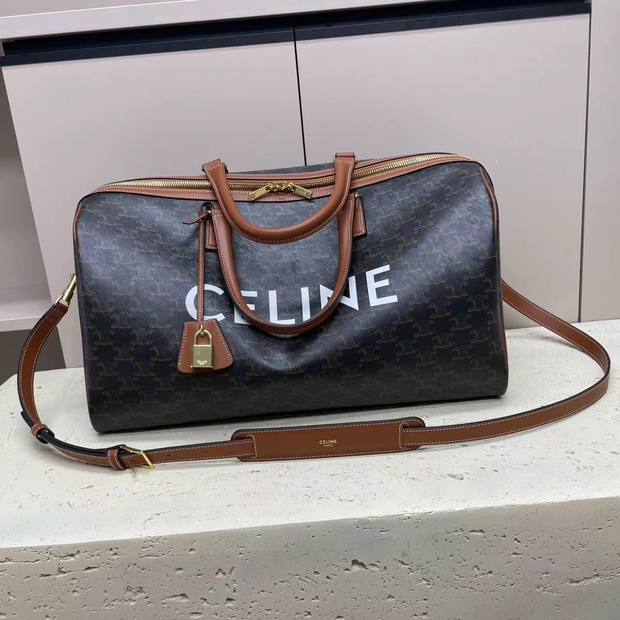 CELINE MEDIUM VOYAGE BAG IN TRIOMPHE CANVAS WITH CELINE PRINT 190662 TAN